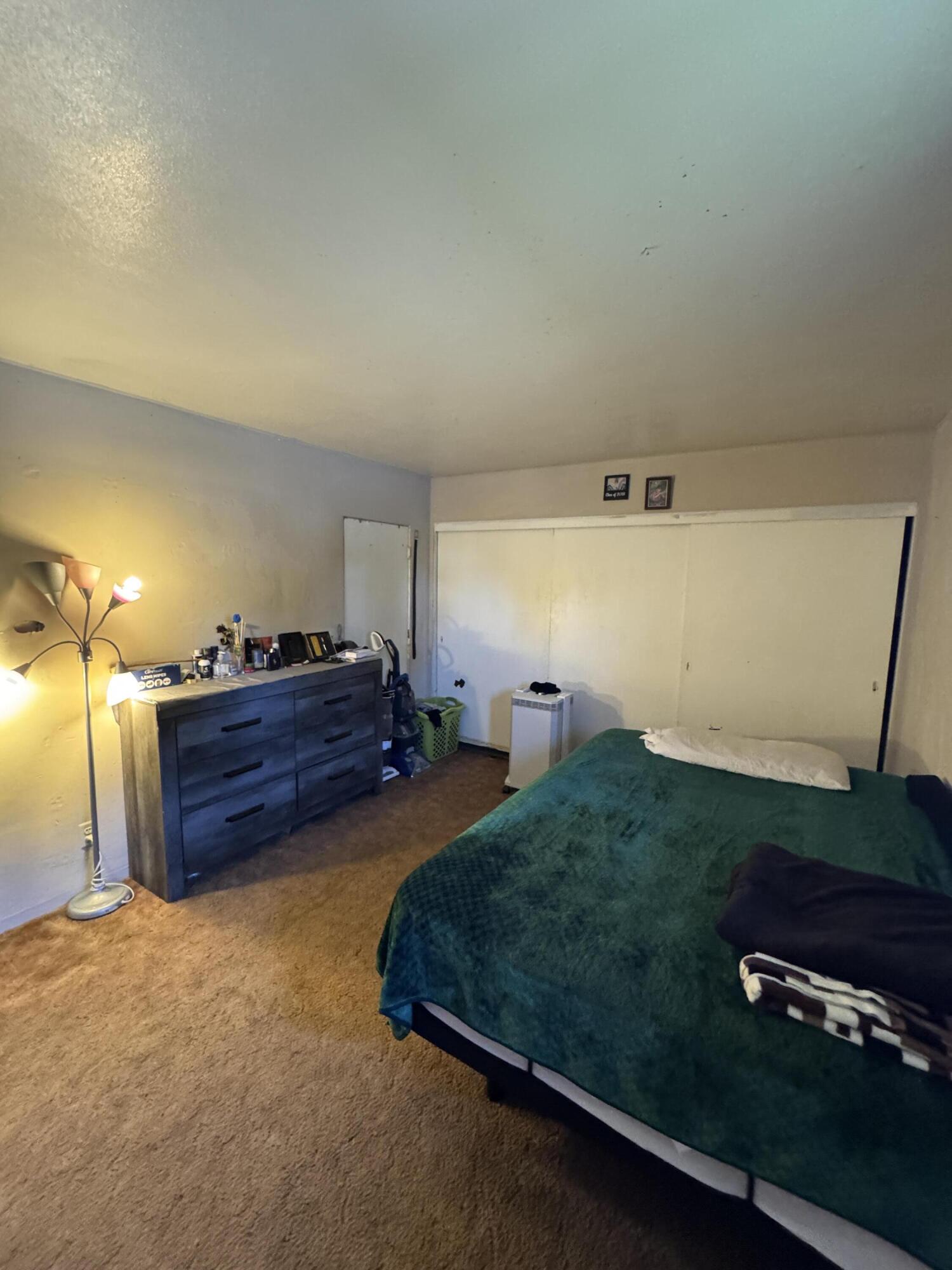 704 North Floral Street Visalia, CA 93291 - Photo 25 of 51 a bed room with furniture and a window