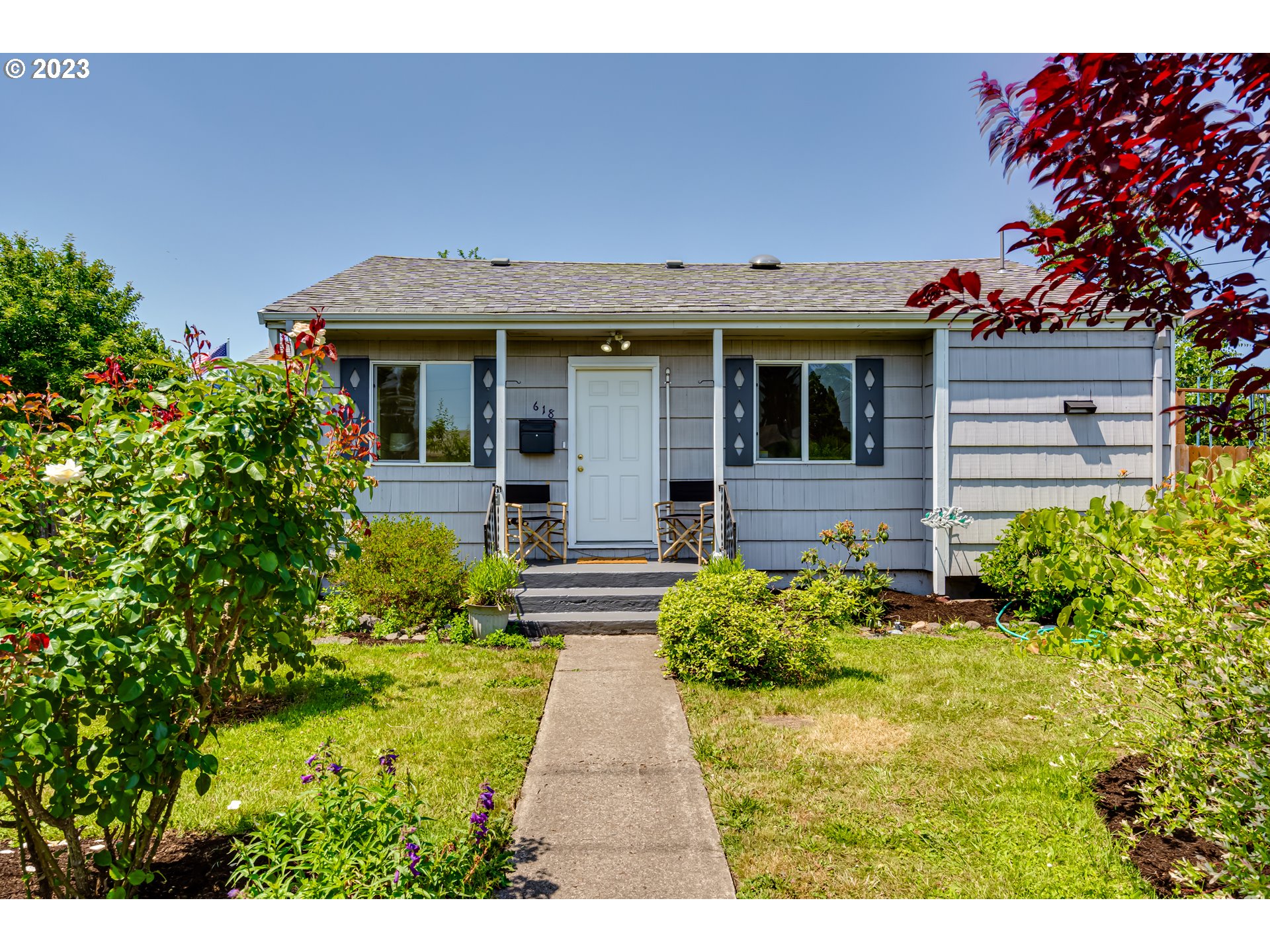 618 19th Street Springfield, OR 97477 - Photo 1 of 6 a front view of a house with a yard