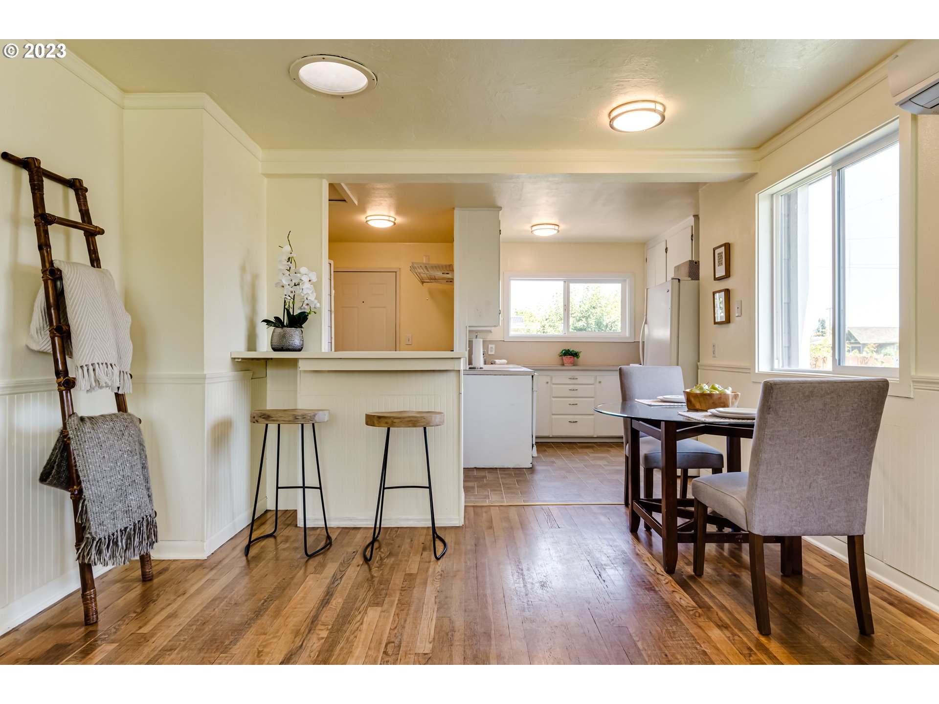 618 19th Street Springfield, OR 97477 - Photo 6 of 6 a view of a dining room with furniture and wooden floor