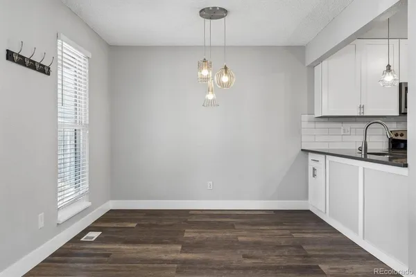 a view of a kitchen with a sink dishwasher and microwave