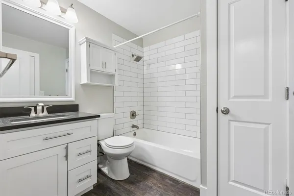 a bathroom with a sink a toilet and a bathtub