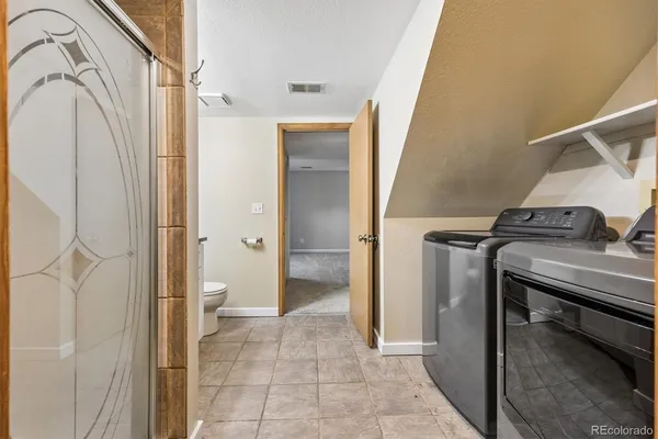 a view of a bathroom from a hallway