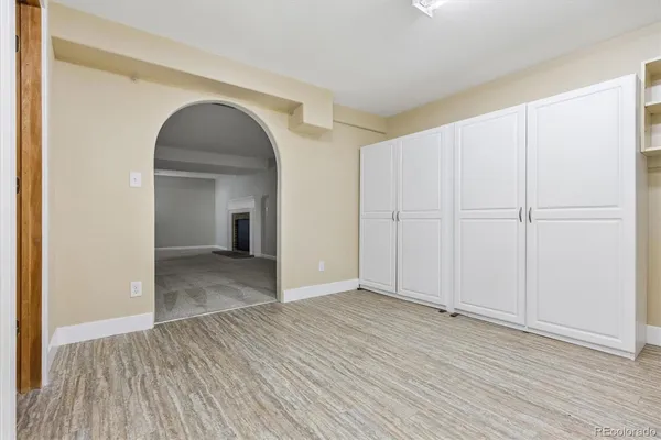 a view of a room with wooden floors and natural light