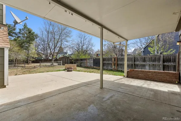 a view of the house with a yard