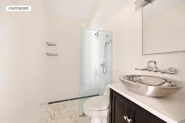 a kitchen with a sink a stove and a refrigerator