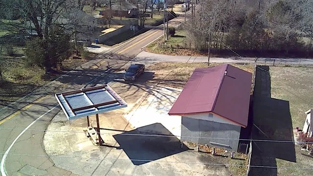 an aerial view of a house with swimming pool