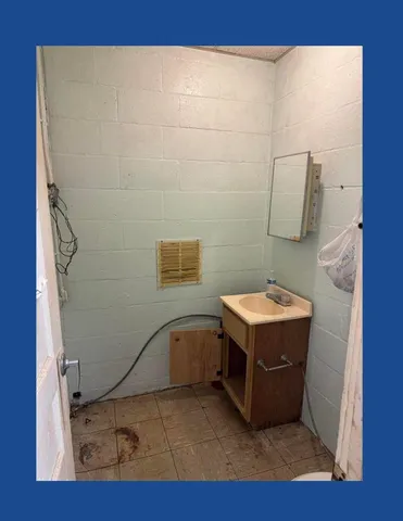 a room with a wooden floor and dryer