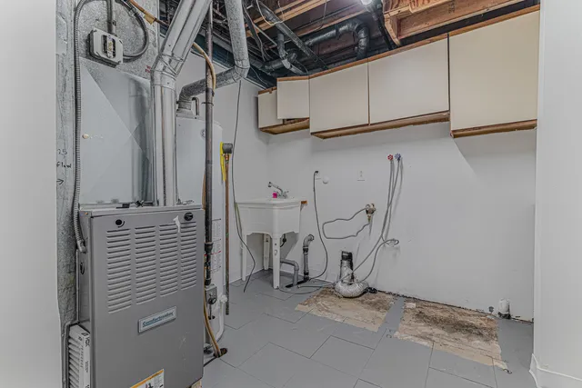 a view of a storage & utility room with racks on the wall