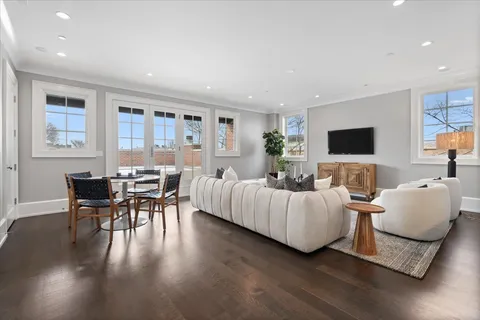 a bathroom with a granite countertop toilet a sink a shower and a mirror