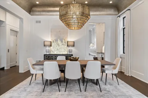 a large kitchen with kitchen island a sink a stove and a wooden floors