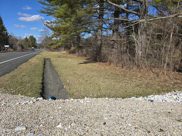a view of a yard with a snow on the road