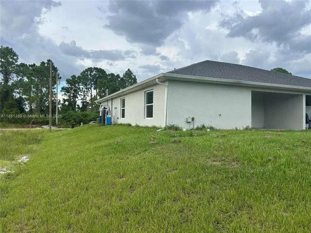 a backyard of a house with lots of green space