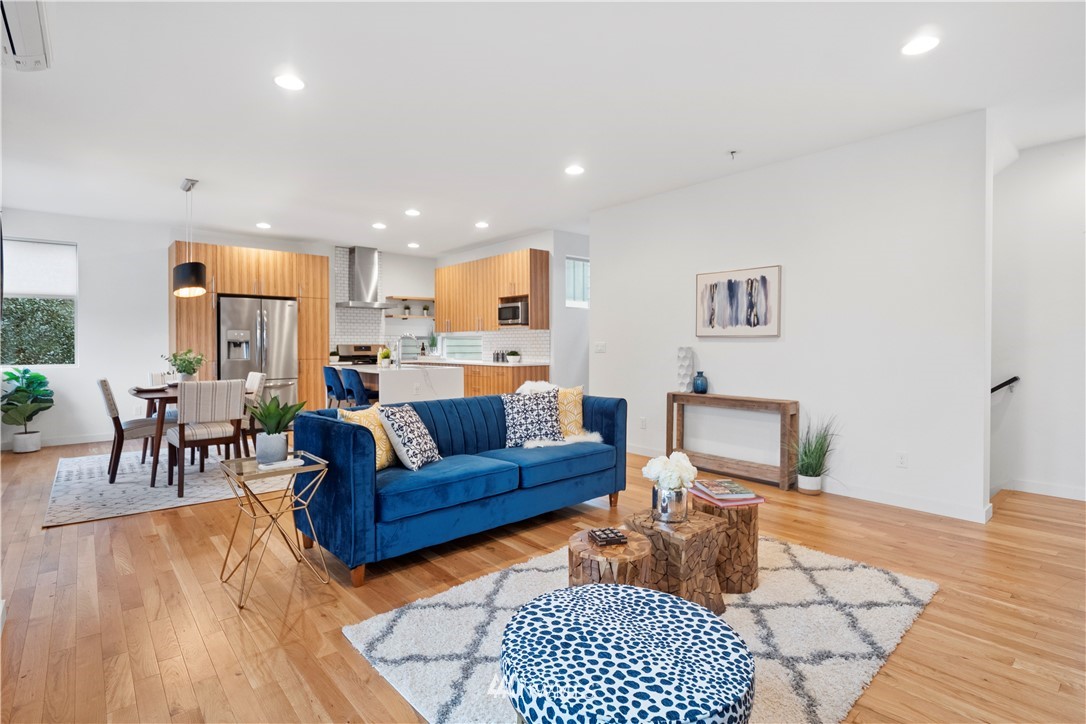3932 South Brandon Street, Unit B Seattle, WA 98118 - Photo 13 of 29 a living room with furniture and a wooden floor