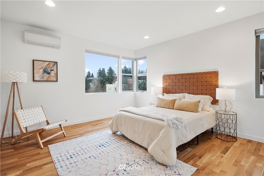 3932 South Brandon Street, Unit B Seattle, WA 98118 - Photo 20 of 29 a bedroom with a bed and a window