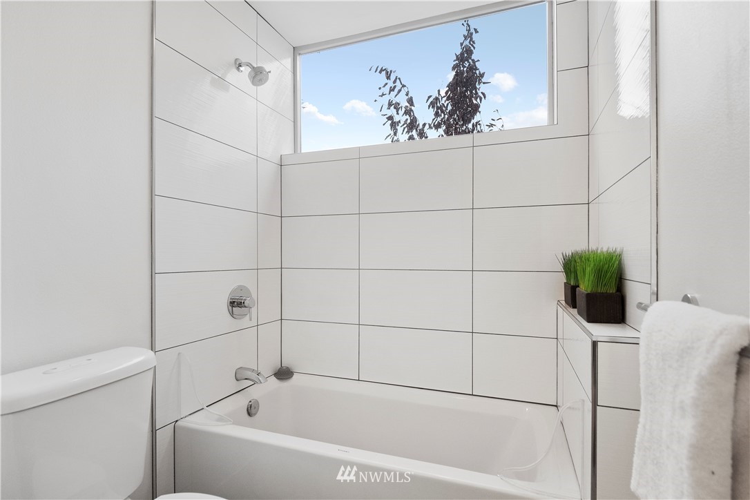 3932 South Brandon Street, Unit B Seattle, WA 98118 - Photo 8 of 29 a bathroom with a bathtub and a shower