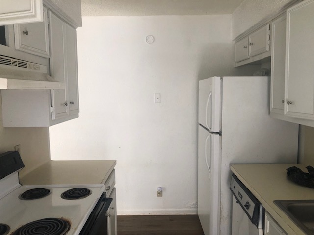 404 West Dittmar Road Austin, TX 78745 - Photo 9 of 15 a kitchen with a refrigerator and a stove