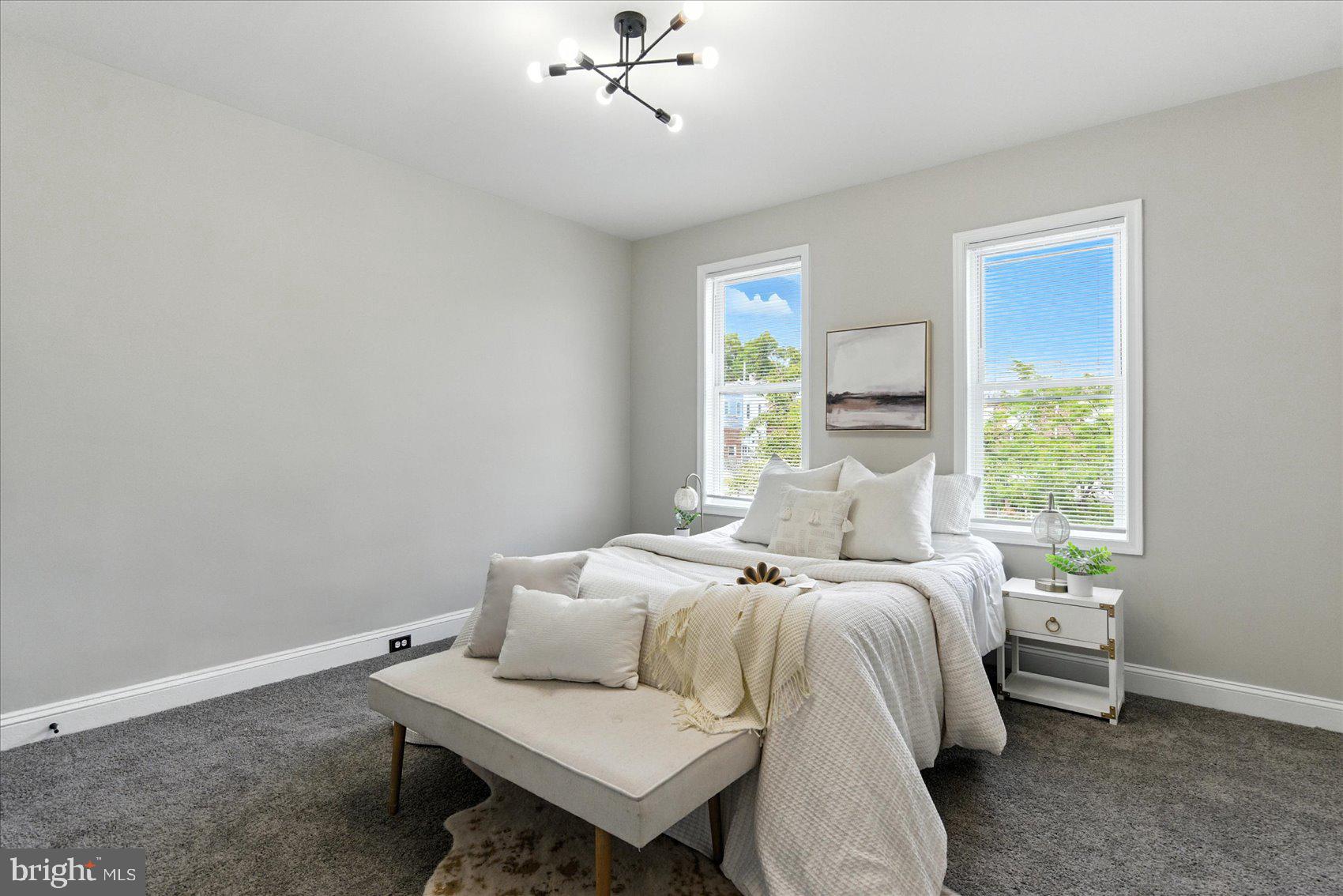 1607 Montpelier Street Baltimore, MD 21218 - Photo 24 of 37 a bedroom with a bed and a window