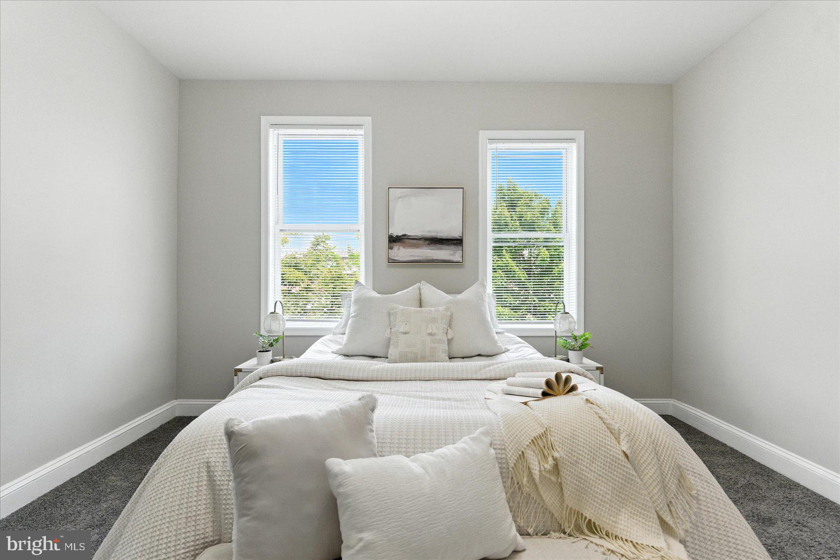 1607 Montpelier Street Baltimore, MD 21218 - Photo 26 of 37 a bedroom with a large bed and a window