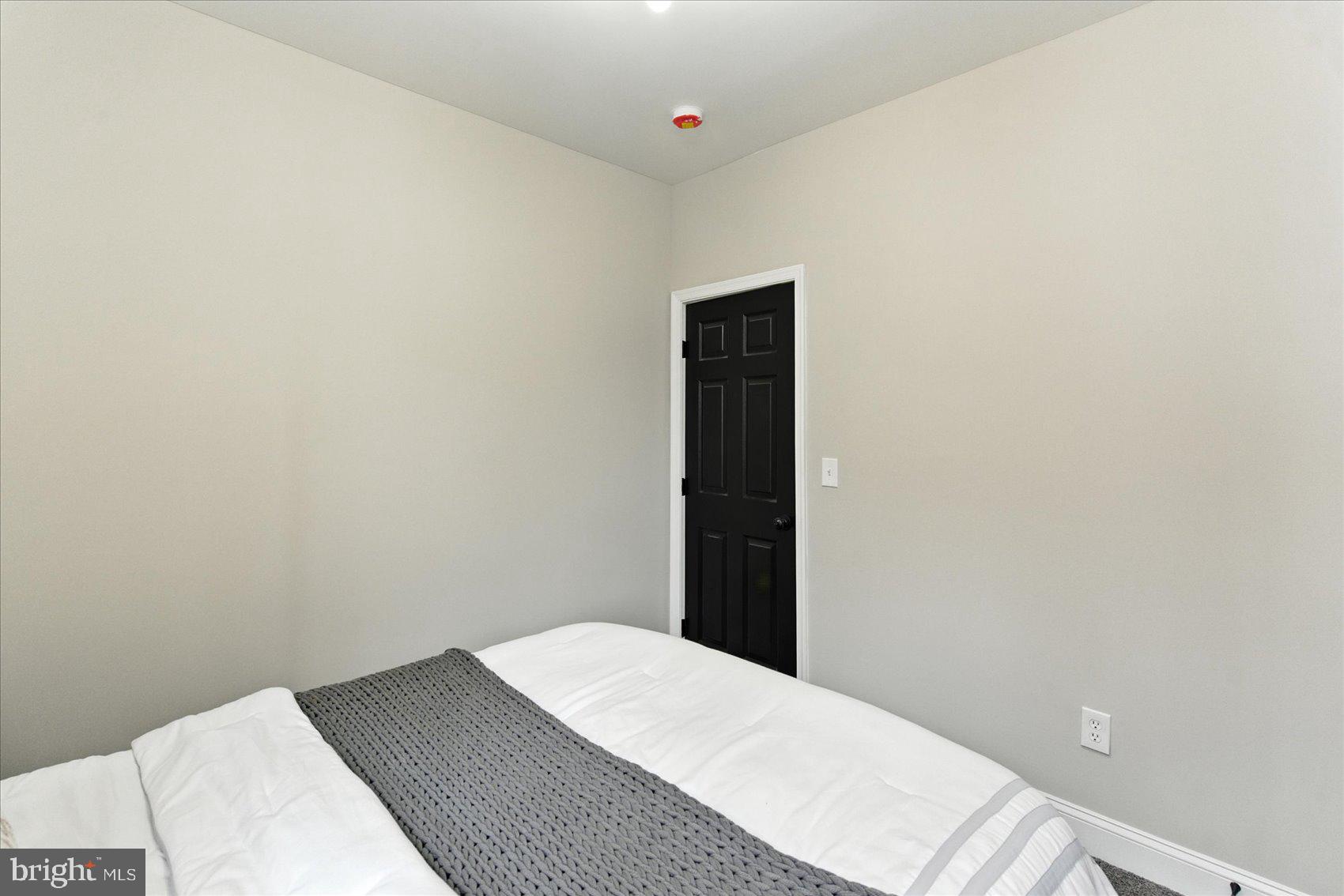 1607 Montpelier Street Baltimore, MD 21218 - Photo 28 of 37 a bed room with a bed