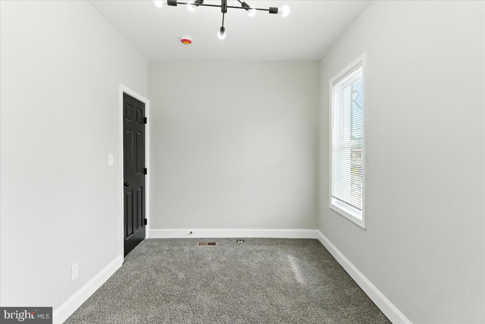 1607 Montpelier Street Baltimore, MD 21218 - Photo 30 of 37 an empty room with windows