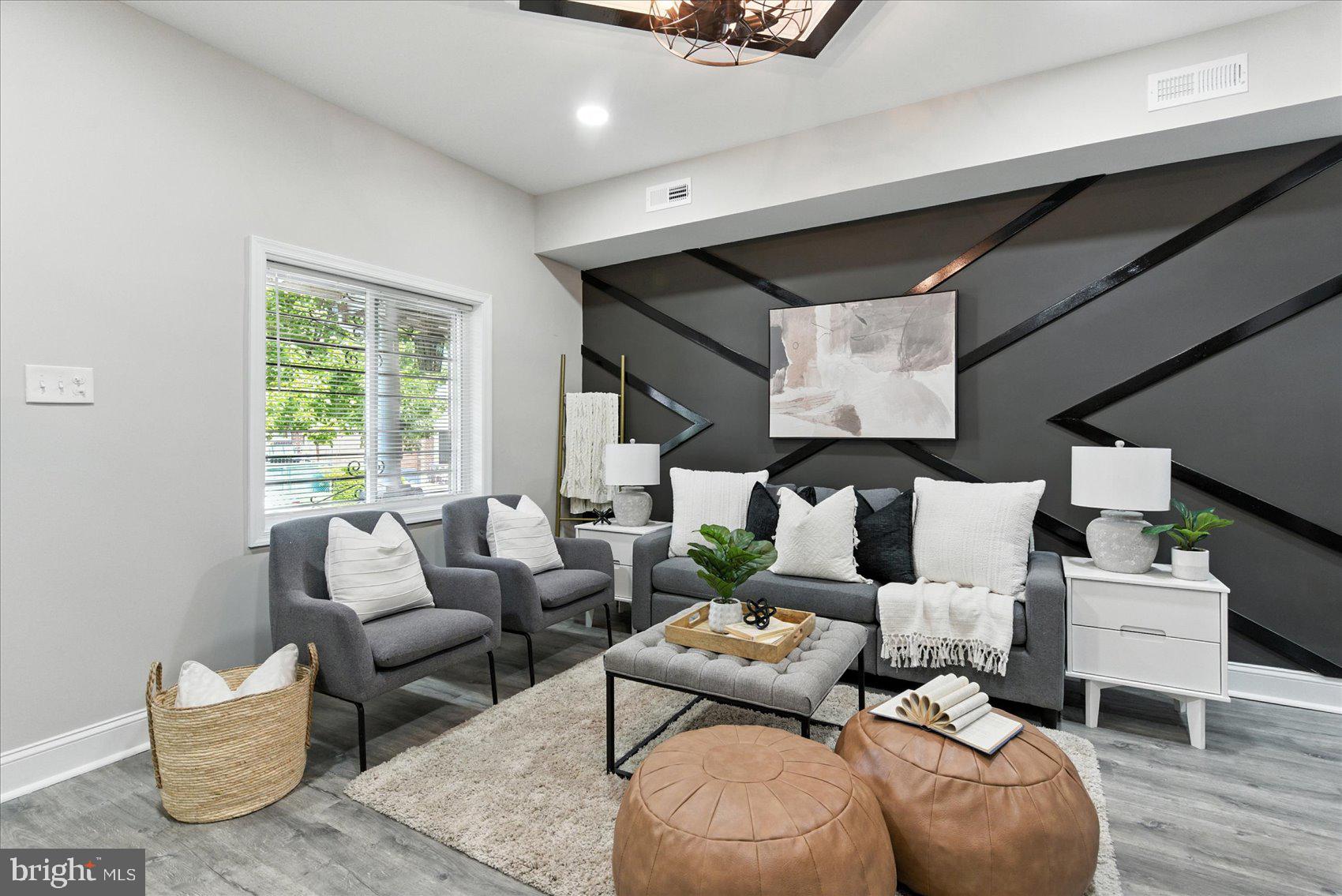 1607 Montpelier Street Baltimore, MD 21218 - Photo 3 of 37 a living room with furniture and a large window