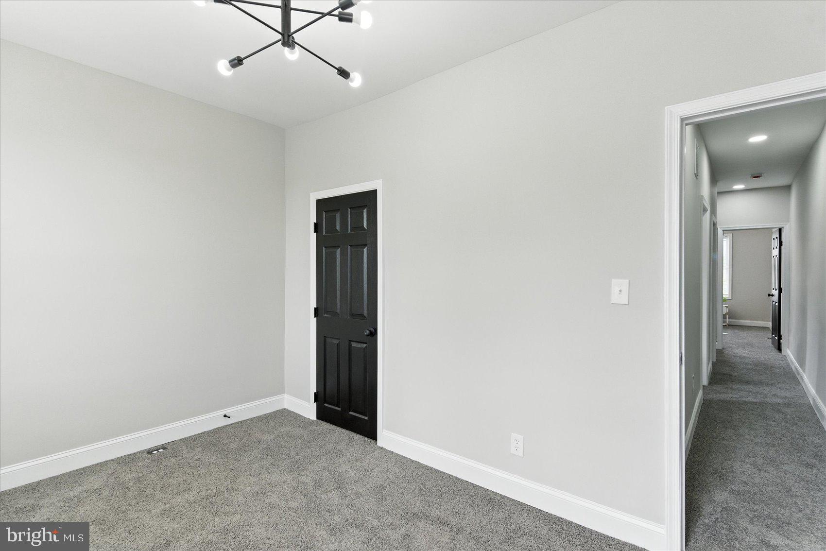 1607 Montpelier Street Baltimore, MD 21218 - Photo 31 of 37 an empty room with closet and a ceiling fan