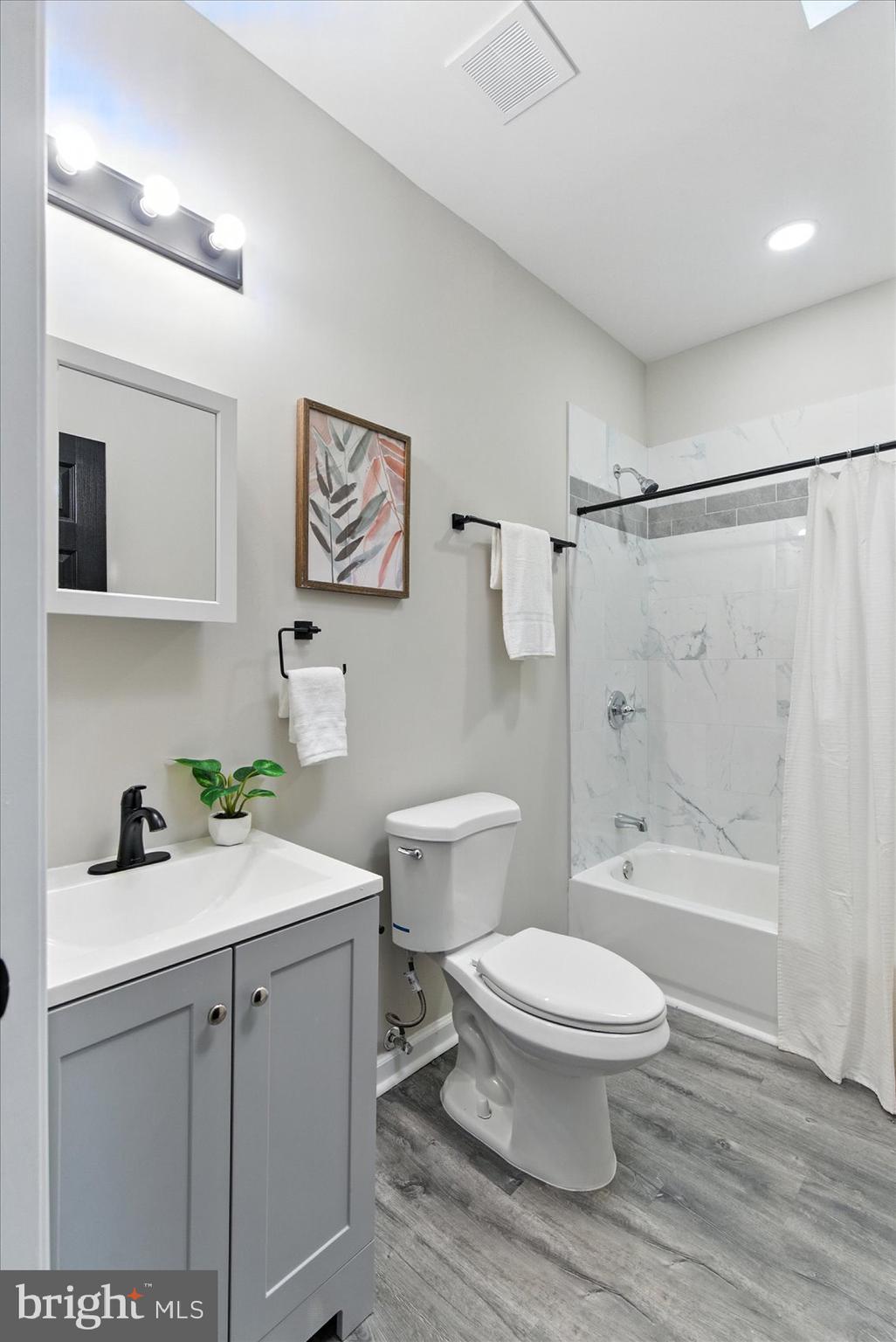1607 Montpelier Street Baltimore, MD 21218 - Photo 33 of 37 a bathroom with a sink a toilet and shower