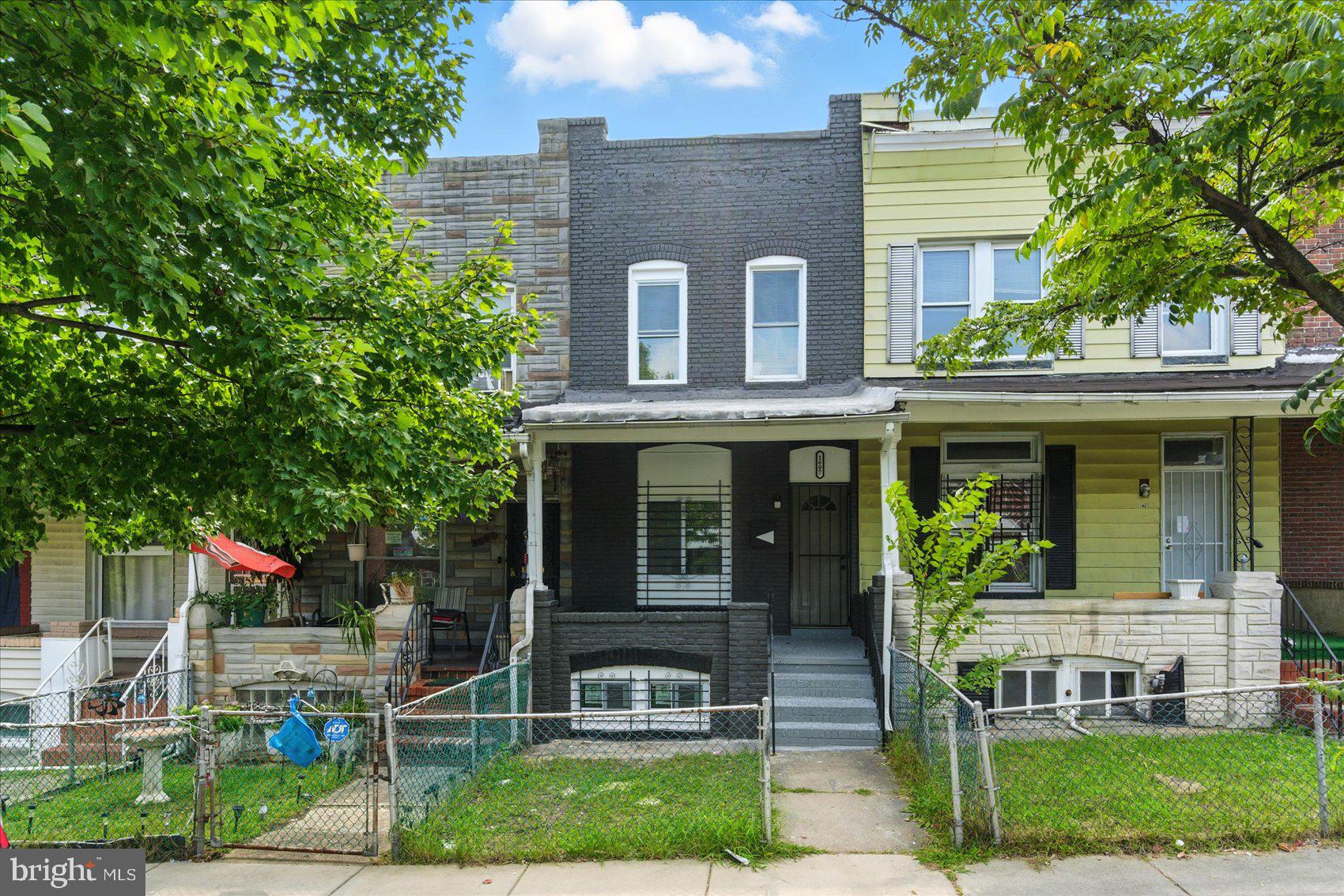 1607 Montpelier Street Baltimore, MD 21218 - Photo 35 of 37 a front view of a house with garden