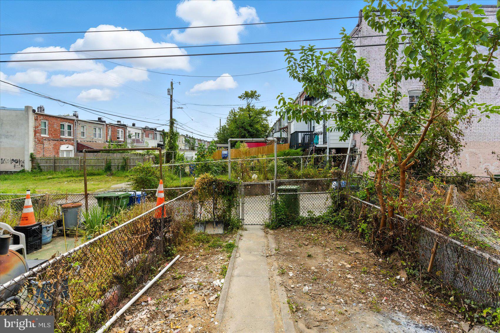 1607 Montpelier Street Baltimore, MD 21218 - Photo 36 of 37 a picture of a table and chairs with wooden floor
