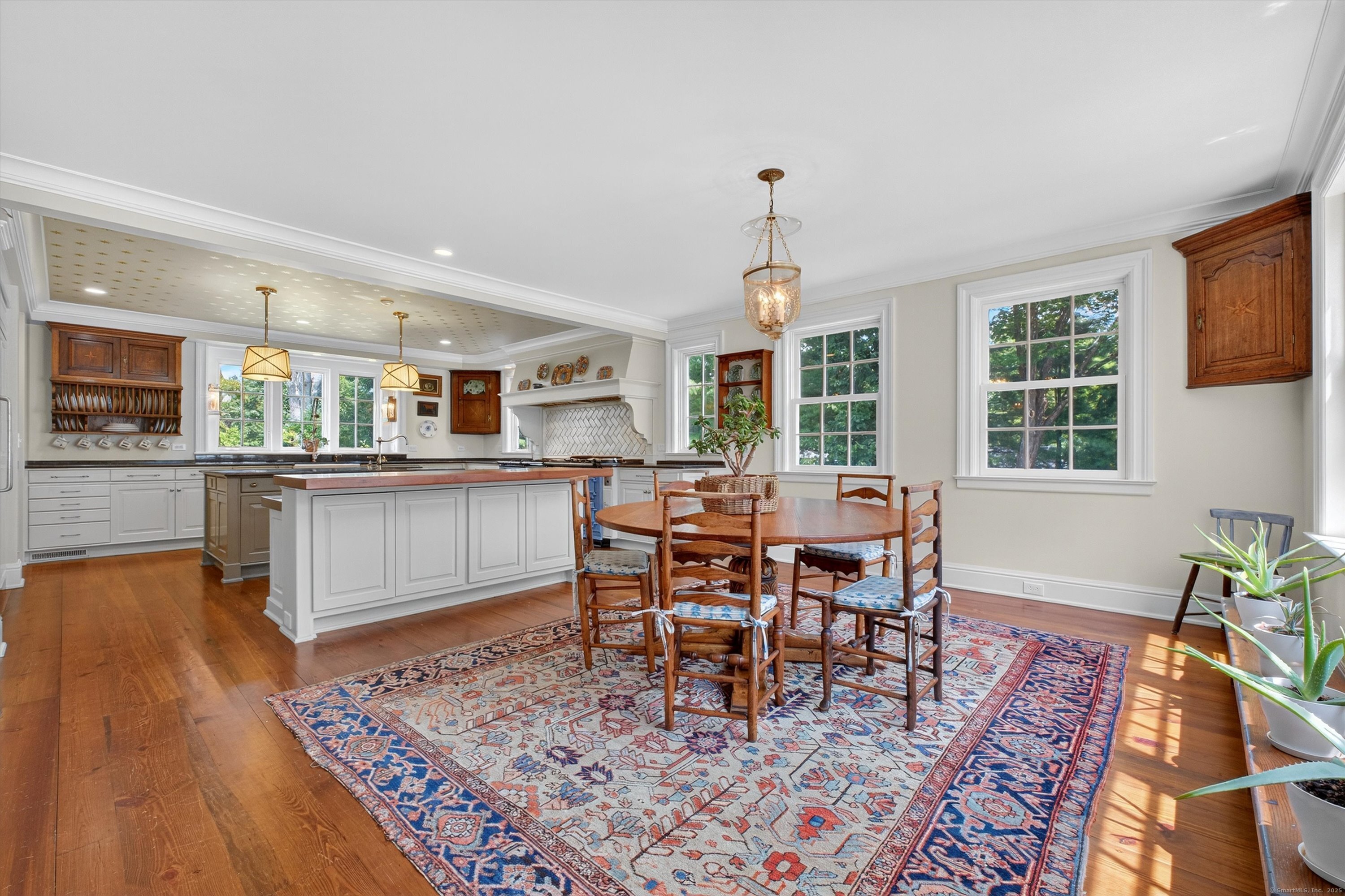 88 Main Street Ridgefield, CT 06877 - Photo 13 of 39 a living room with stainless steel appliances granite countertop furniture wooden floor and a rug