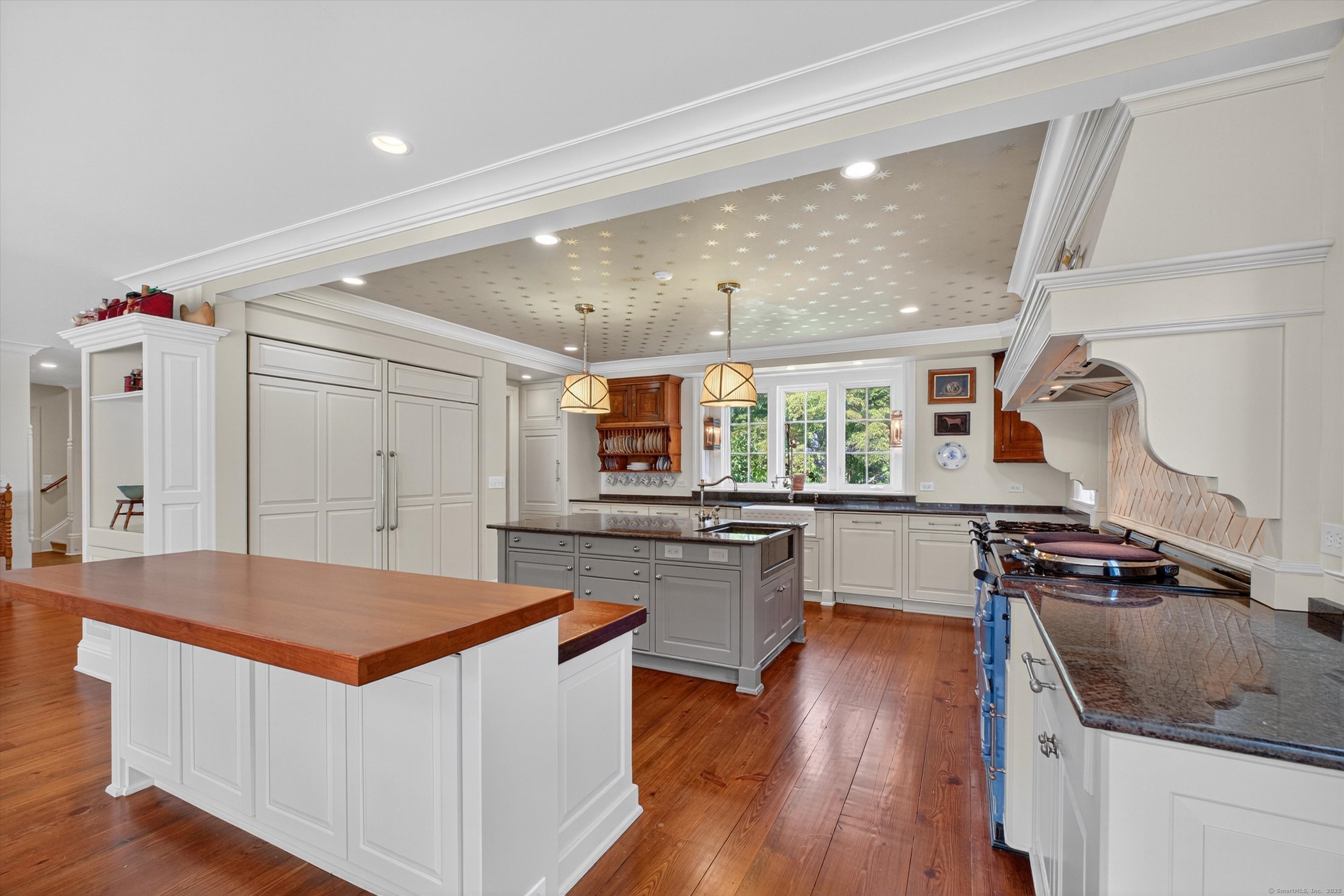 88 Main Street Ridgefield, CT 06877 - Photo 15 of 39 a kitchen with a stove a sink and a refrigerator