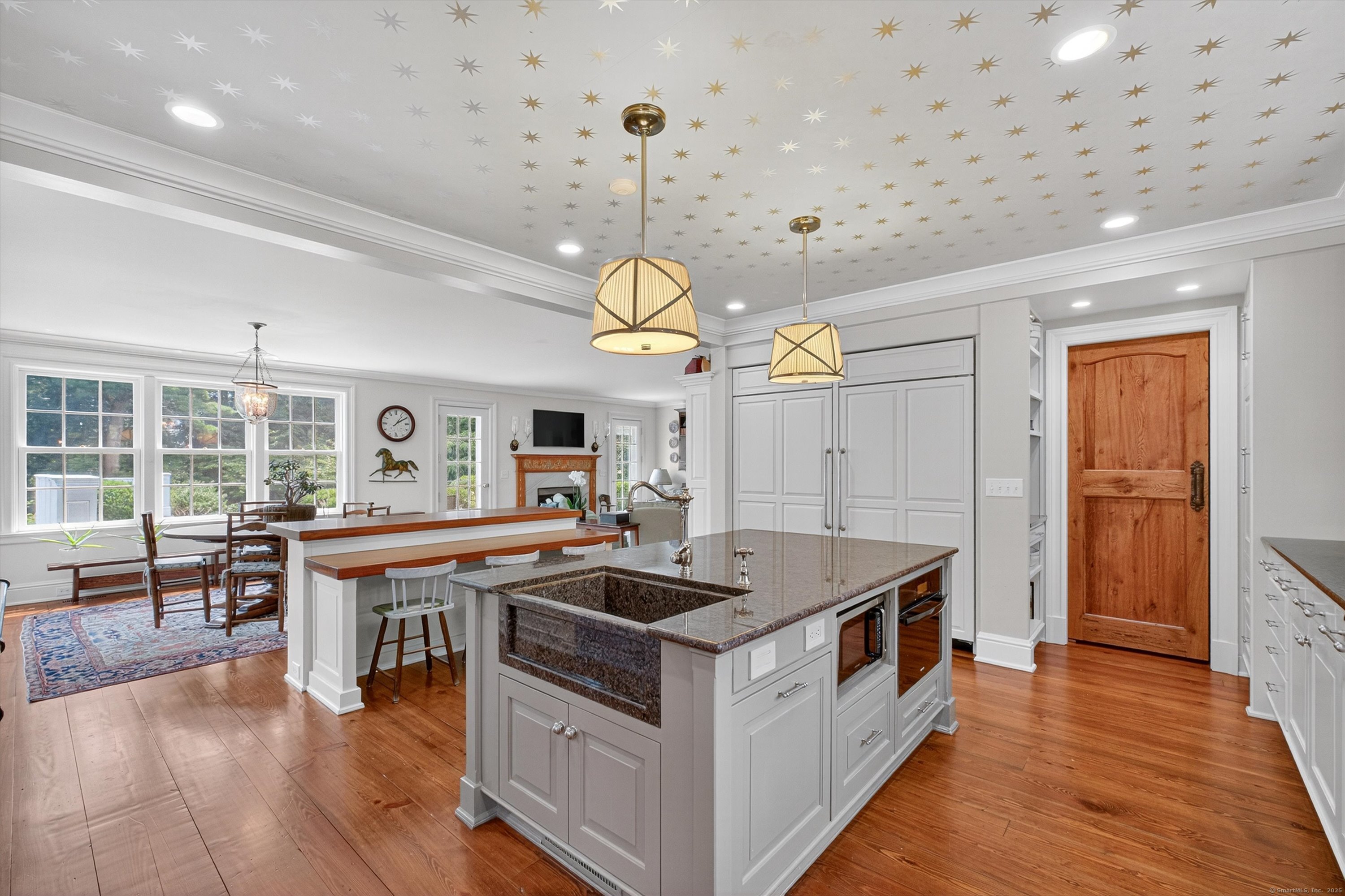 88 Main Street Ridgefield, CT 06877 - Photo 16 of 39 a kitchen that has a lot of cabinets and wooden floor