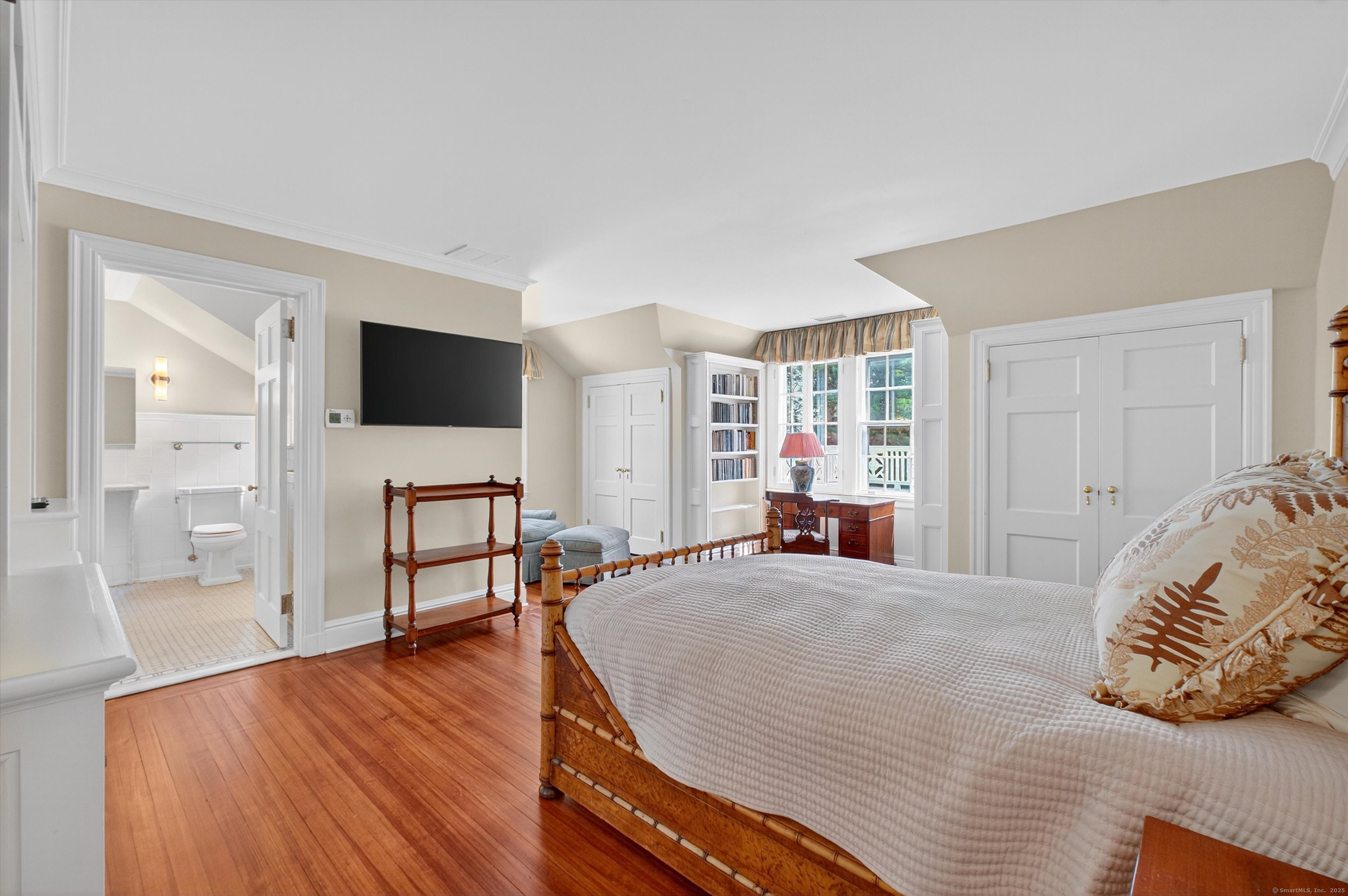 88 Main Street Ridgefield, CT 06877 - Photo 22 of 39 a bedroom with a bed and wooden floor