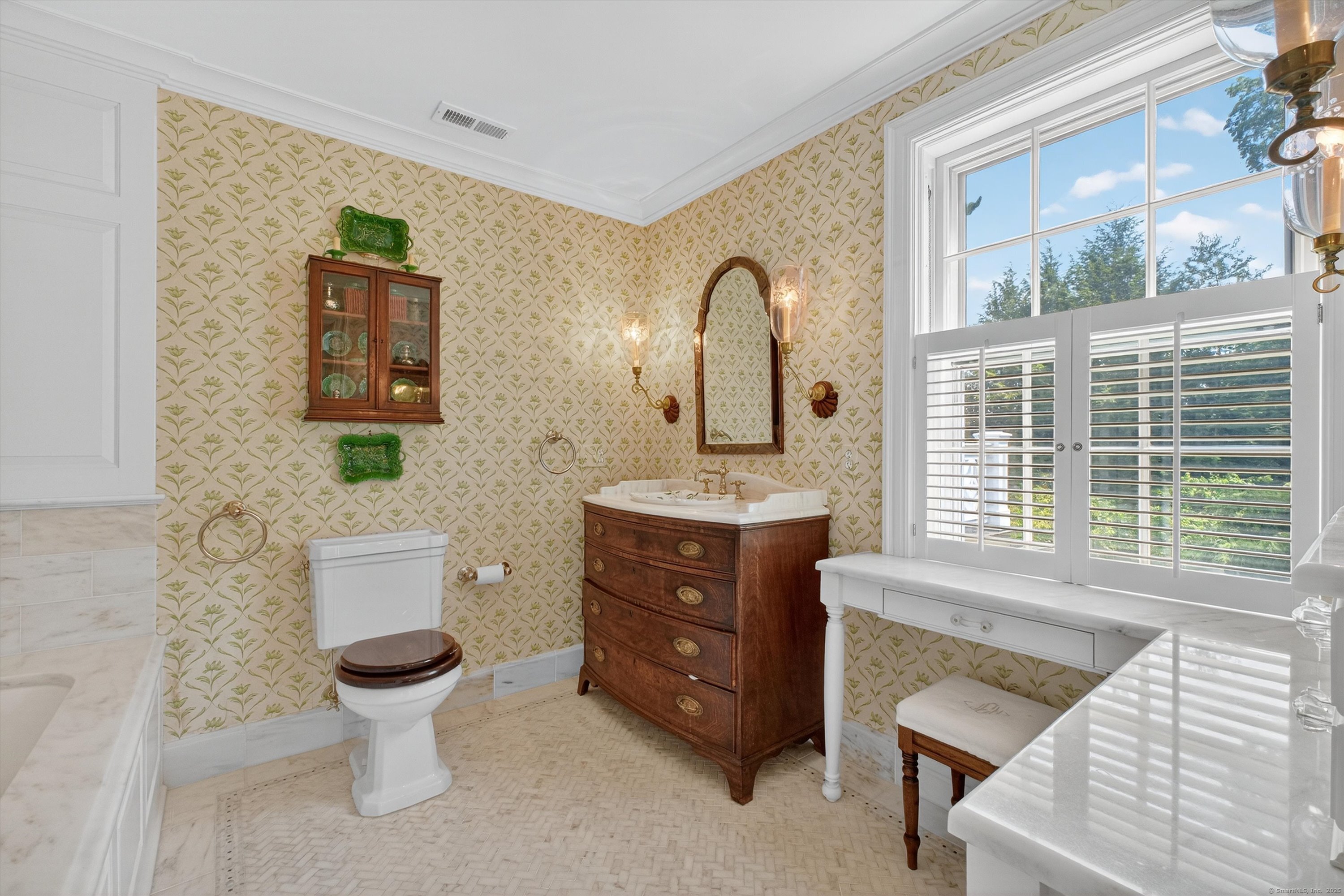 88 Main Street Ridgefield, CT 06877 - Photo 24 of 39 a bathroom with a toilet sink and mirror