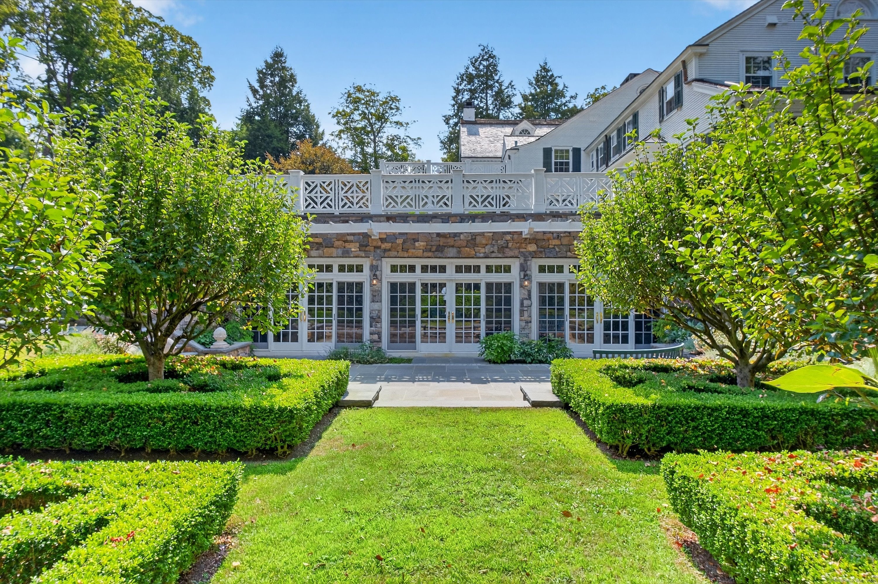 88 Main Street Ridgefield, CT 06877 - Photo 35 of 39 a view of a house with a yard and sitting area