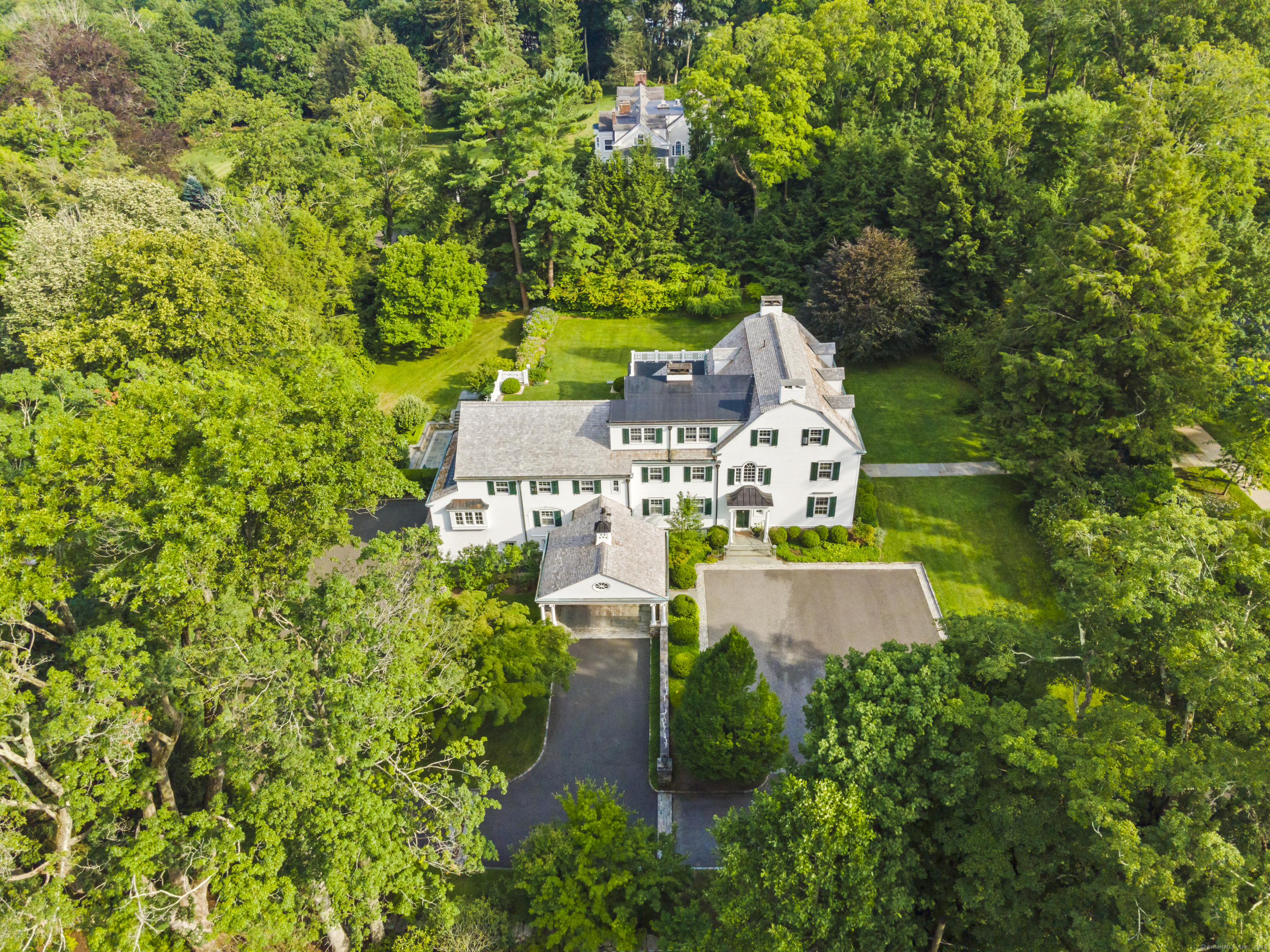 88 Main Street Ridgefield, CT 06877 - Photo 39 of 39 an aerial view of a house with swimming pool and garden space