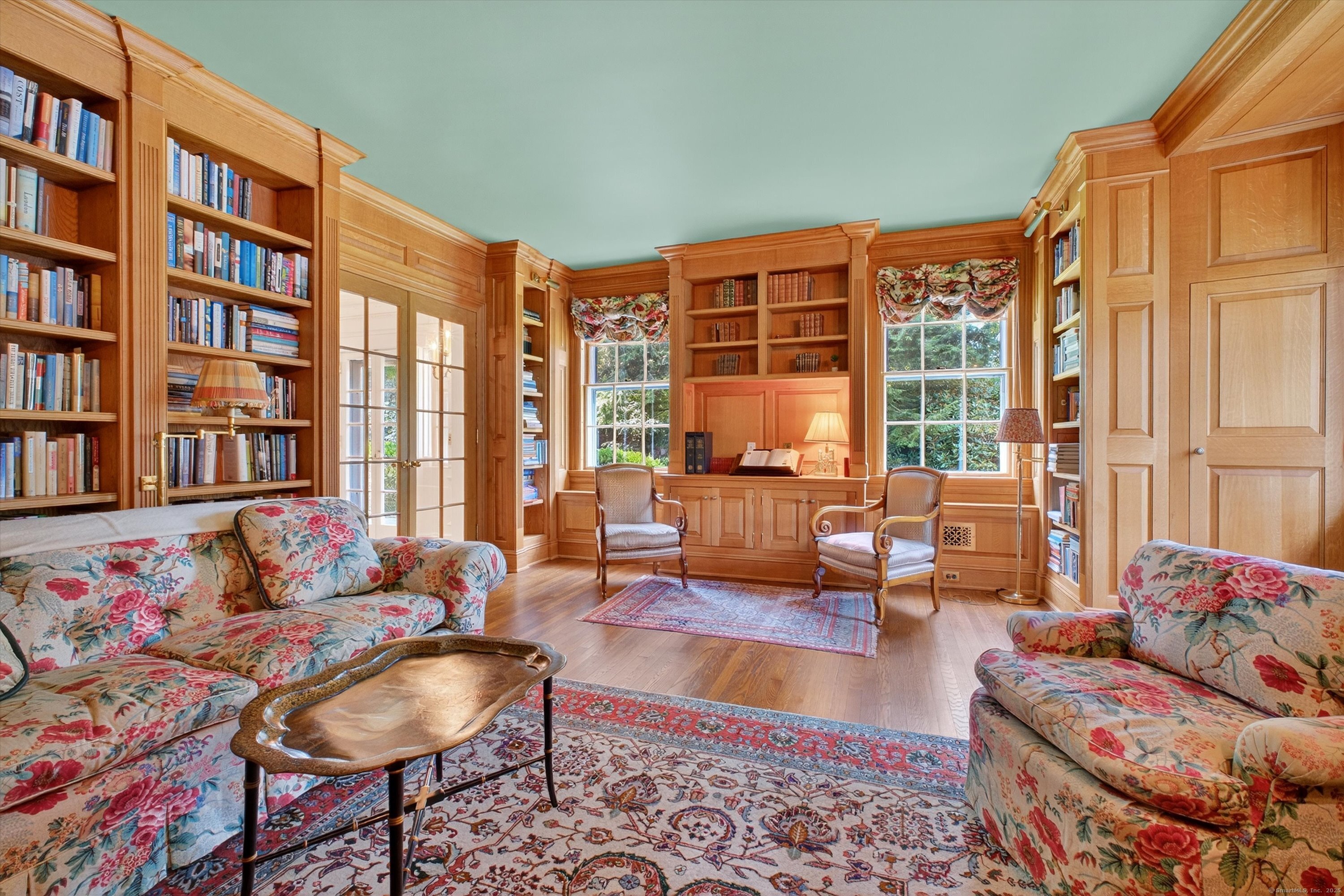 88 Main Street Ridgefield, CT 06877 - Photo 8 of 39 a living room with furniture and a book shelf