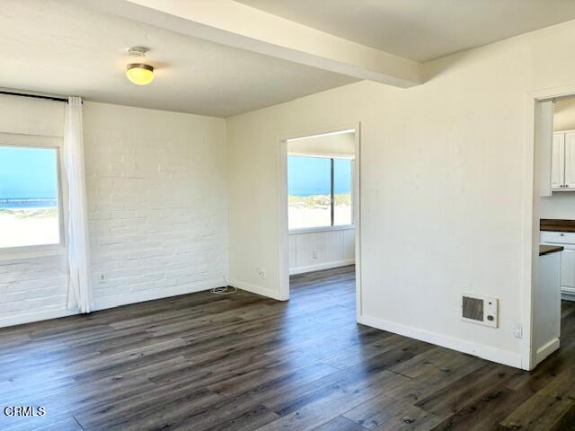 3289 Ocean Drive, Unit 3 Oxnard, CA 93035 - Photo 4 of 18 an empty room with wooden floor and windows
