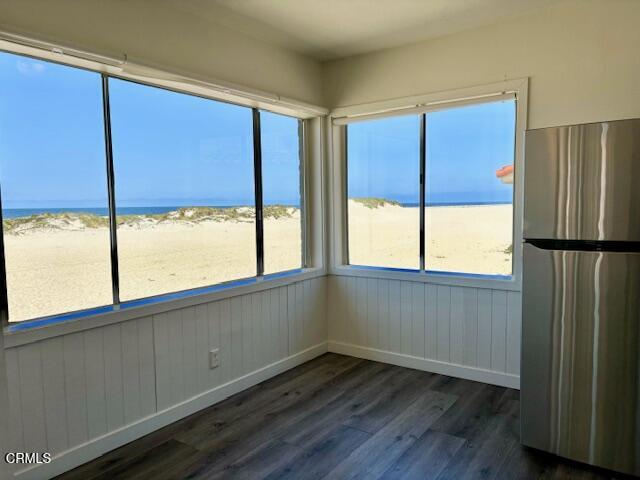3289 Ocean Drive, Unit 3 Oxnard, CA 93035 - Photo 7 of 18 a view of an empty room with wooden floor and a window