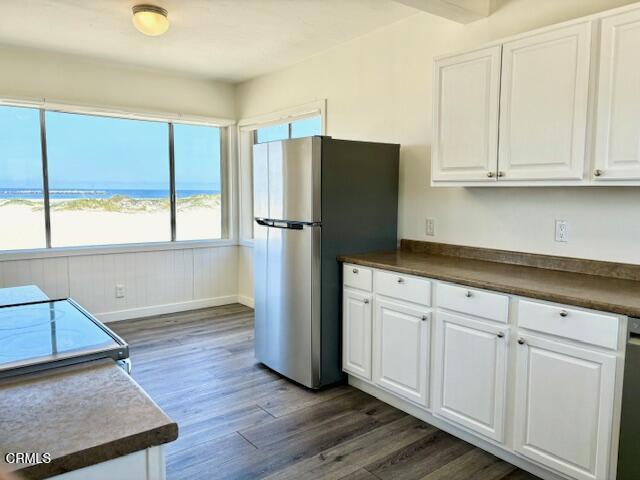3289 Ocean Drive, Unit 3 Oxnard, CA 93035 - Photo 9 of 18 a kitchen with a refrigerator and window