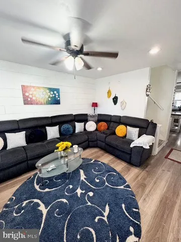 a bedroom with furniture and a rug