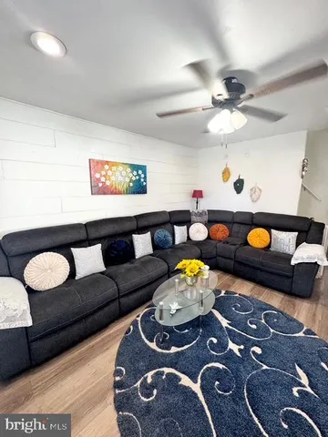 a living room with furniture and a rug