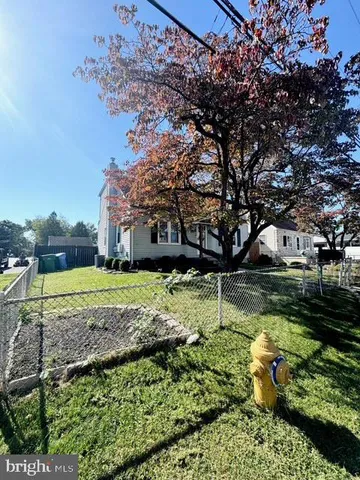 a view of a garden with a house
