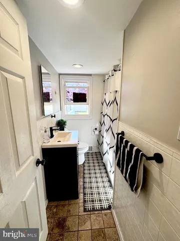 a bathroom with a sink and mirror
