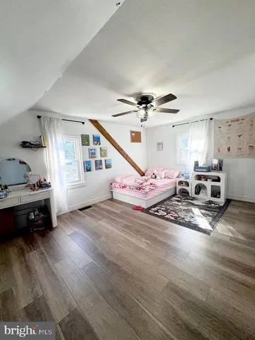 a view of a livingroom with wooden floor