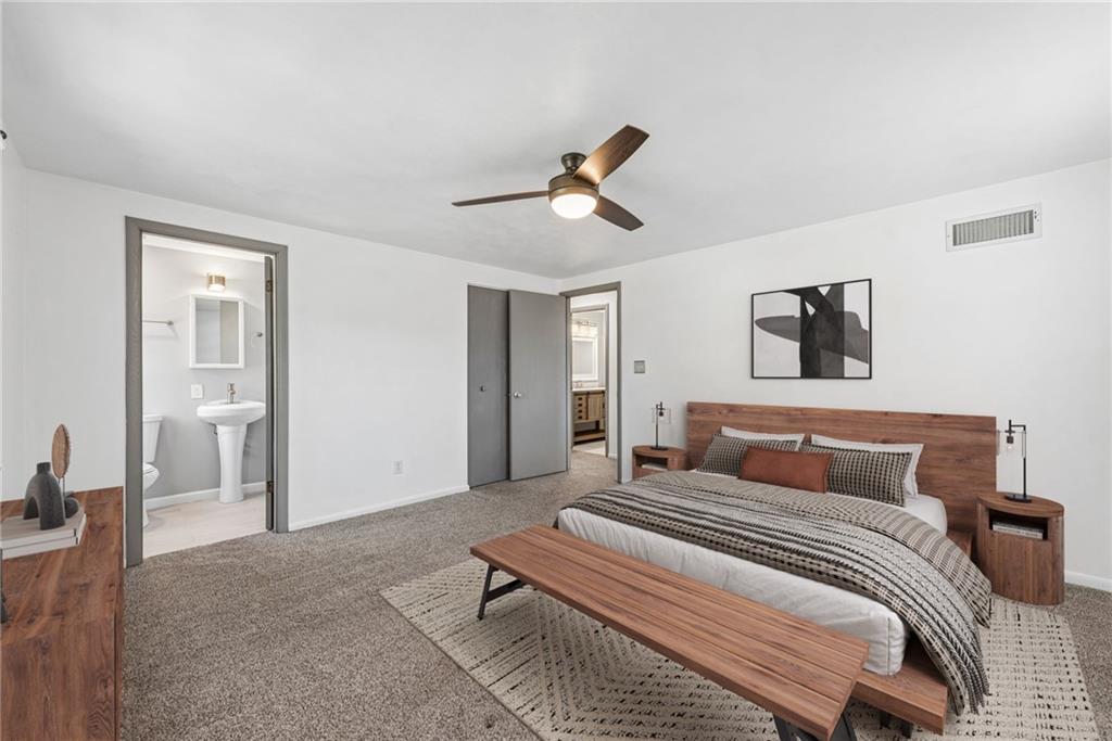 126 Jefferson Drive Apollo, PA 15613 - Photo 17 of 31 a bedroom with a bed and a chandelier