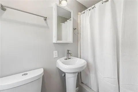 a bedroom with a bed and furniture