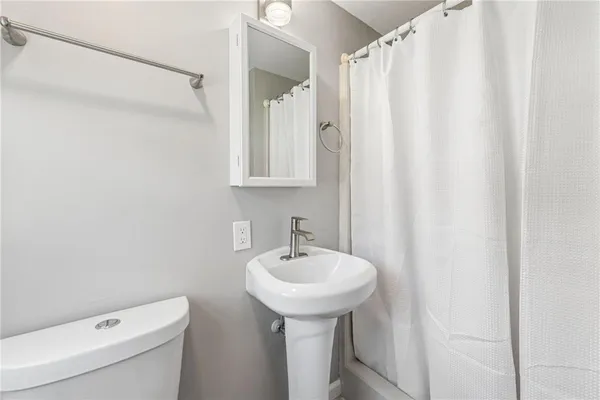 a bedroom with a bed and furniture