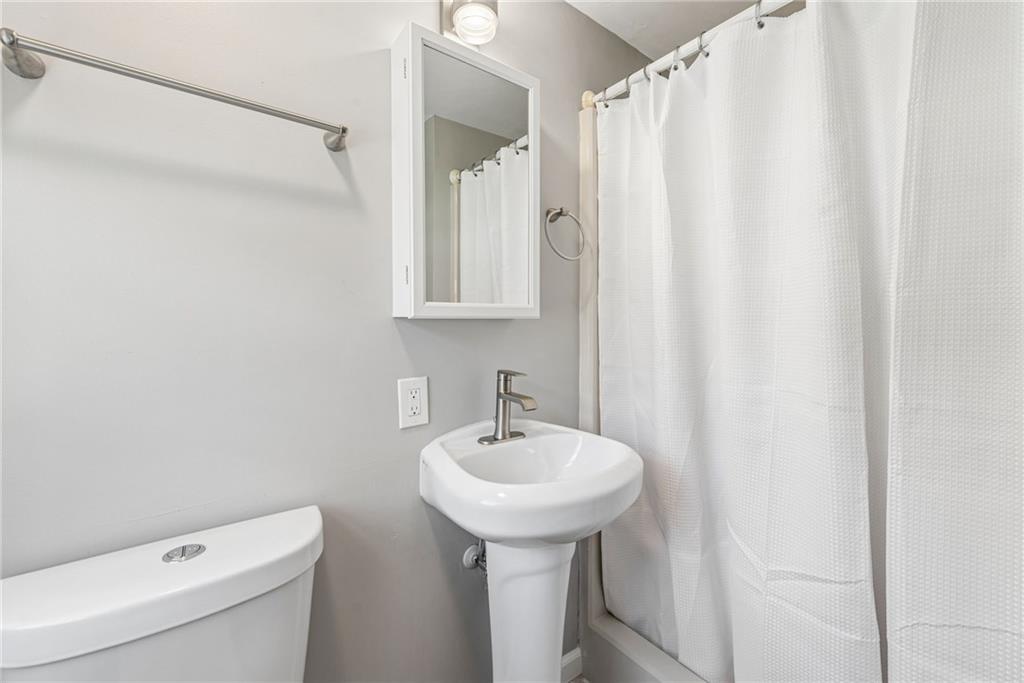 126 Jefferson Drive Apollo, PA 15613 - Photo 18 of 31 a bathroom with a sink a toilet and a mirror