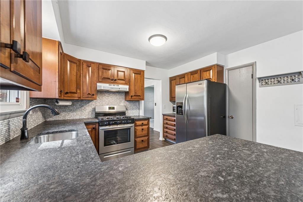 126 Jefferson Drive Apollo, PA 15613 - Photo 10 of 31 a kitchen with stainless steel appliances granite countertop a refrigerator stove and sink
